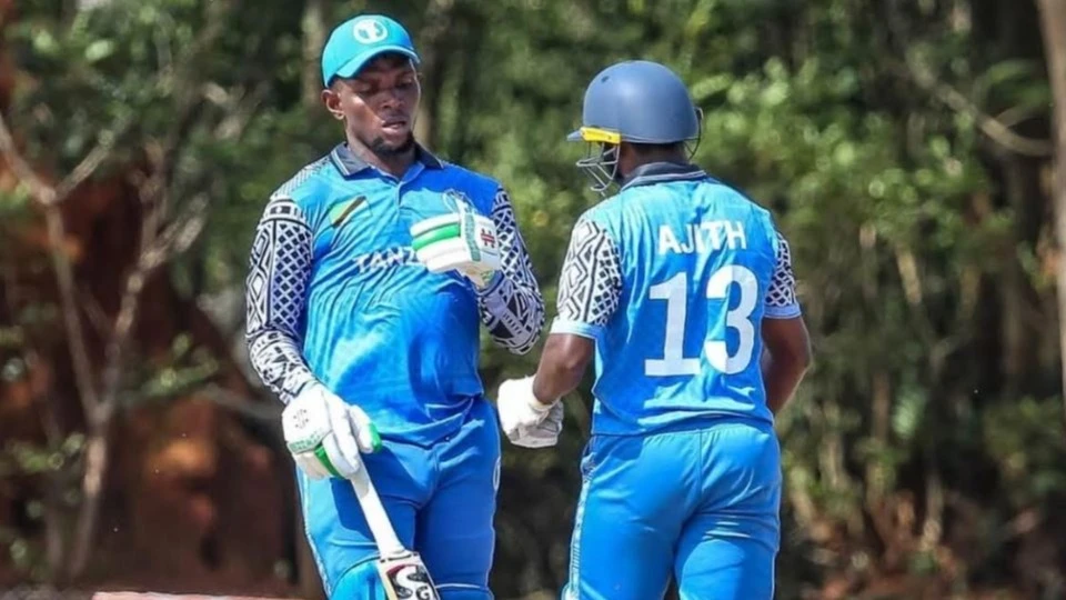 Tanzania's senior cricket team's Ivan Ismail (L) and Ajith Augastin discuss game tactics during the 2026 ICC Men’s T20 World Cup Sub-Regional Africa Qualifier B game against St.Helena in Accra, Ghana on Saturday.