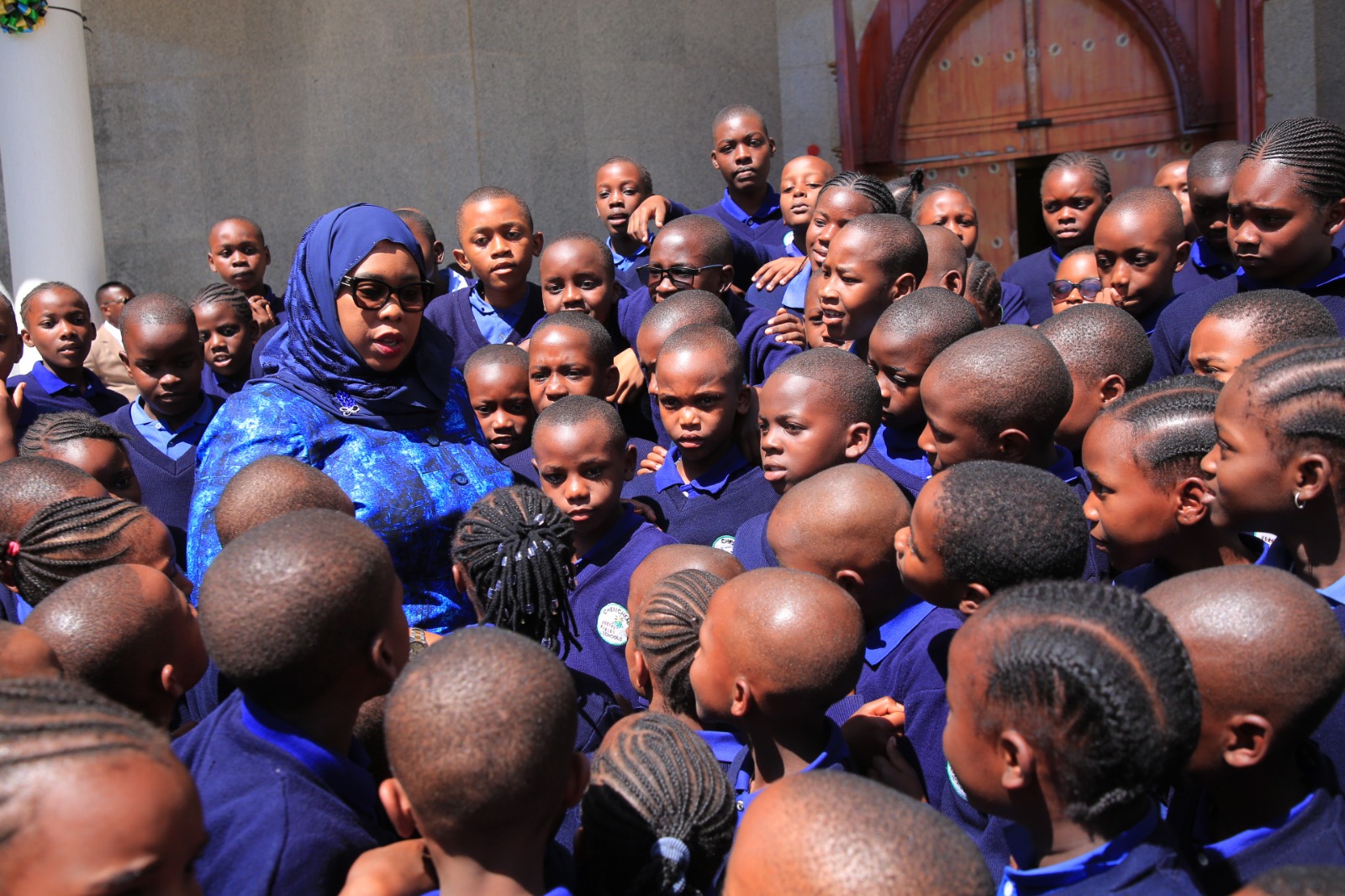  Education, Science and Technology deputy minister Wanu Hafidh Ameir has a word with pupils of Dodoma Urban District’s Chemchemi Primary School as they toured the National Assembly in Dodoma city yesterday. 