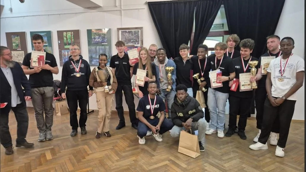 Competitors pose for a group photo after the first-ever intercontinental chess match between Africa and Poland, held recently in the historic city of Zamosc in eastern Poland.