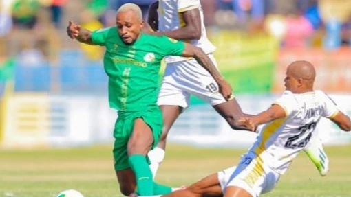 Young Africans winger Pacome Zouzoua challenges Azam FC midfielder Himid Mao during their CRDB Federation Cup semi-final match at CCM Kirumba Stadium in Mwanza yesterday.