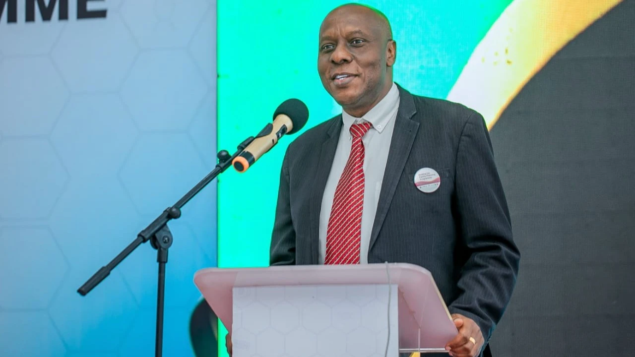  Dr. Moke Magoma, EngenderHealth Public Health Specialist and Tanzania Country Representative, delivers a speech during the nine-year Scaling Up Family Planning Programme (SuFP) Learning Symposium, themed “Sustaining Gains Made in Sexual and Reproductive 