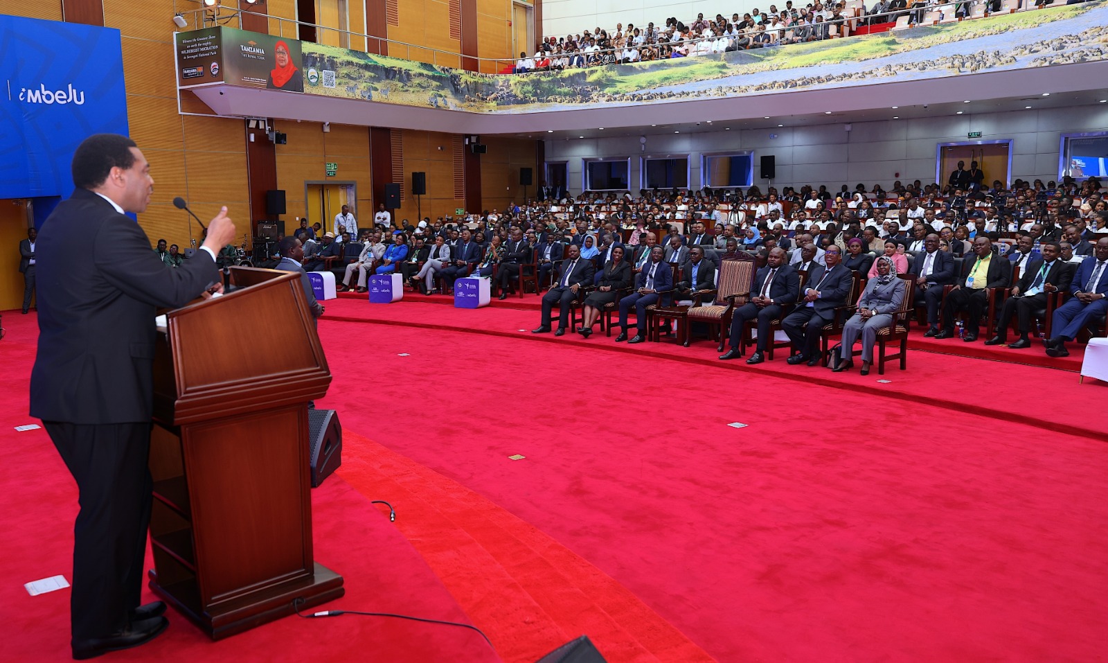 Prime Minister Dr Mwigulu Nchemba delivers a speech when representing President Samia Suluhu Hassan at the grand finale of the Youth Economy Challenge held in Dar es Salaam yesterday