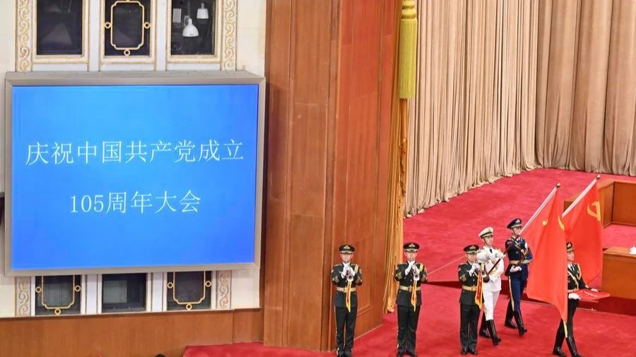 Honor guards escort the July 1 Medal into the Great Hall of the People in Beijing, capital of China, July 1, 2026. 