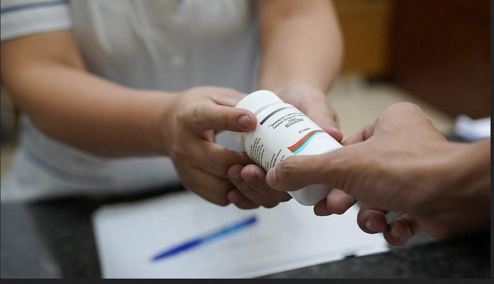 A nurse giving medicine to a patient. Scientific findings suggest HIV prevention and treatment may be entering an era defined by long-acting options rather than daily pills.